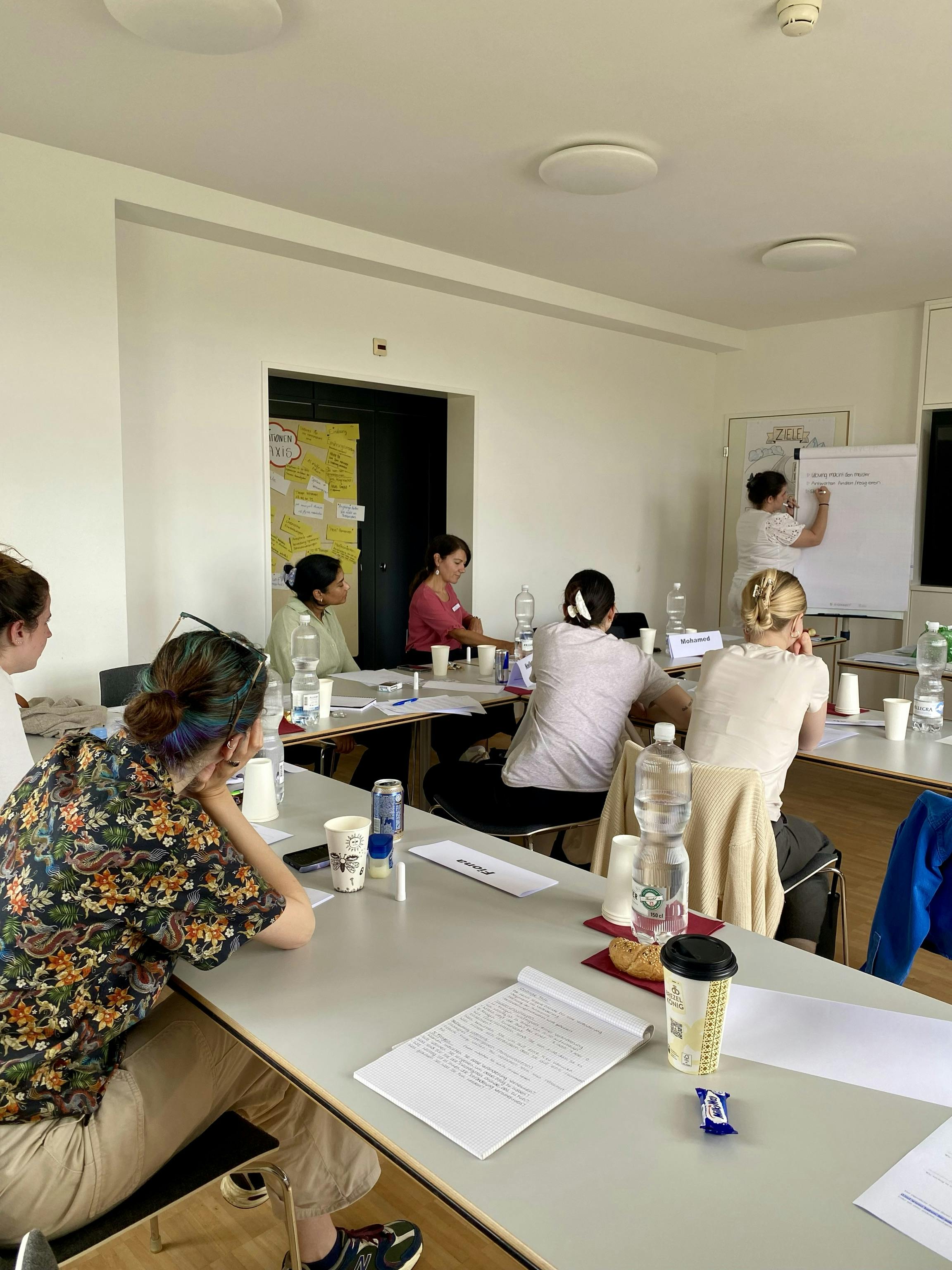 Office training with participants who pay attention to a lecturer.