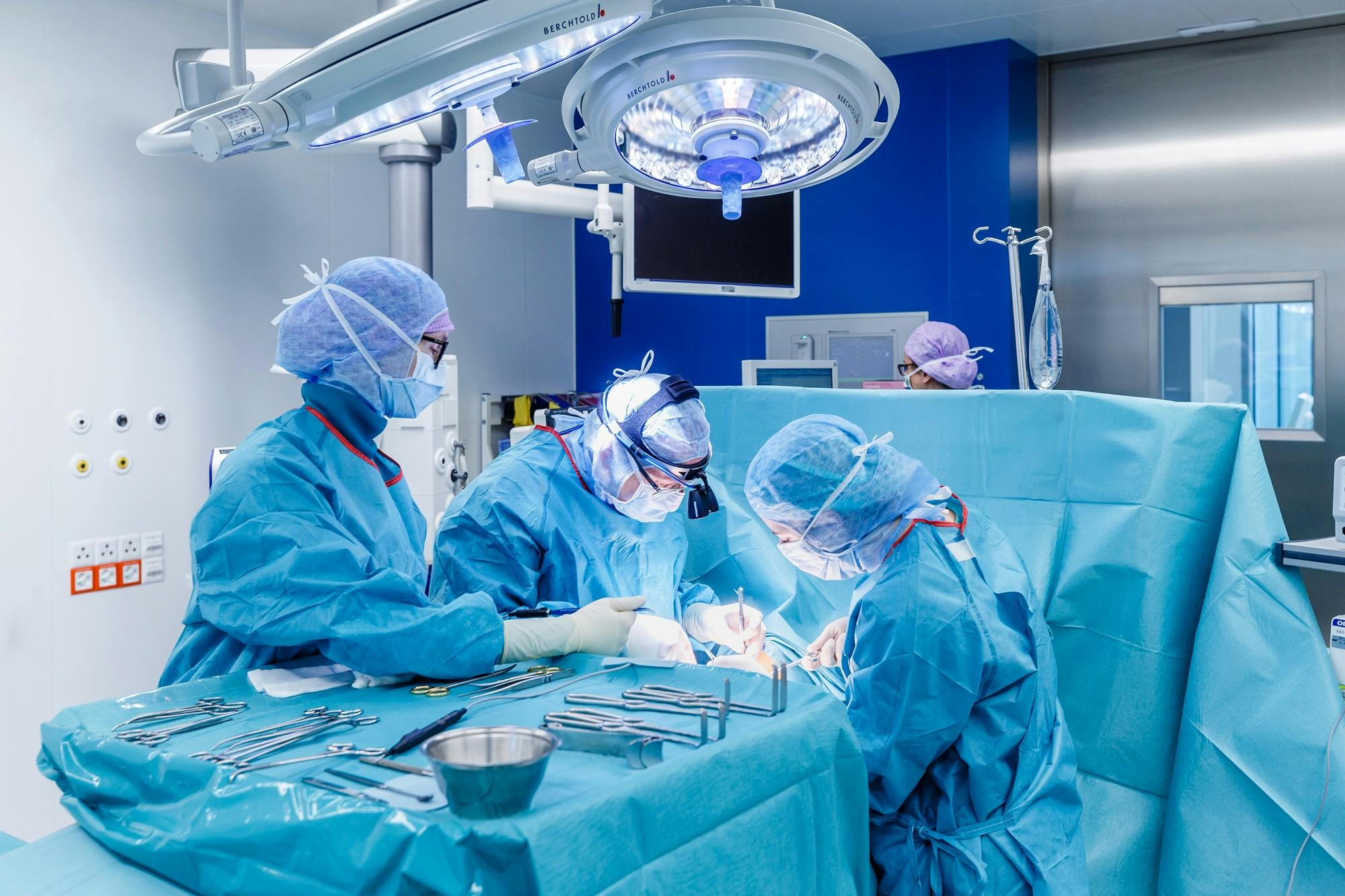 Surgeon team during an operation in the operating theatre.