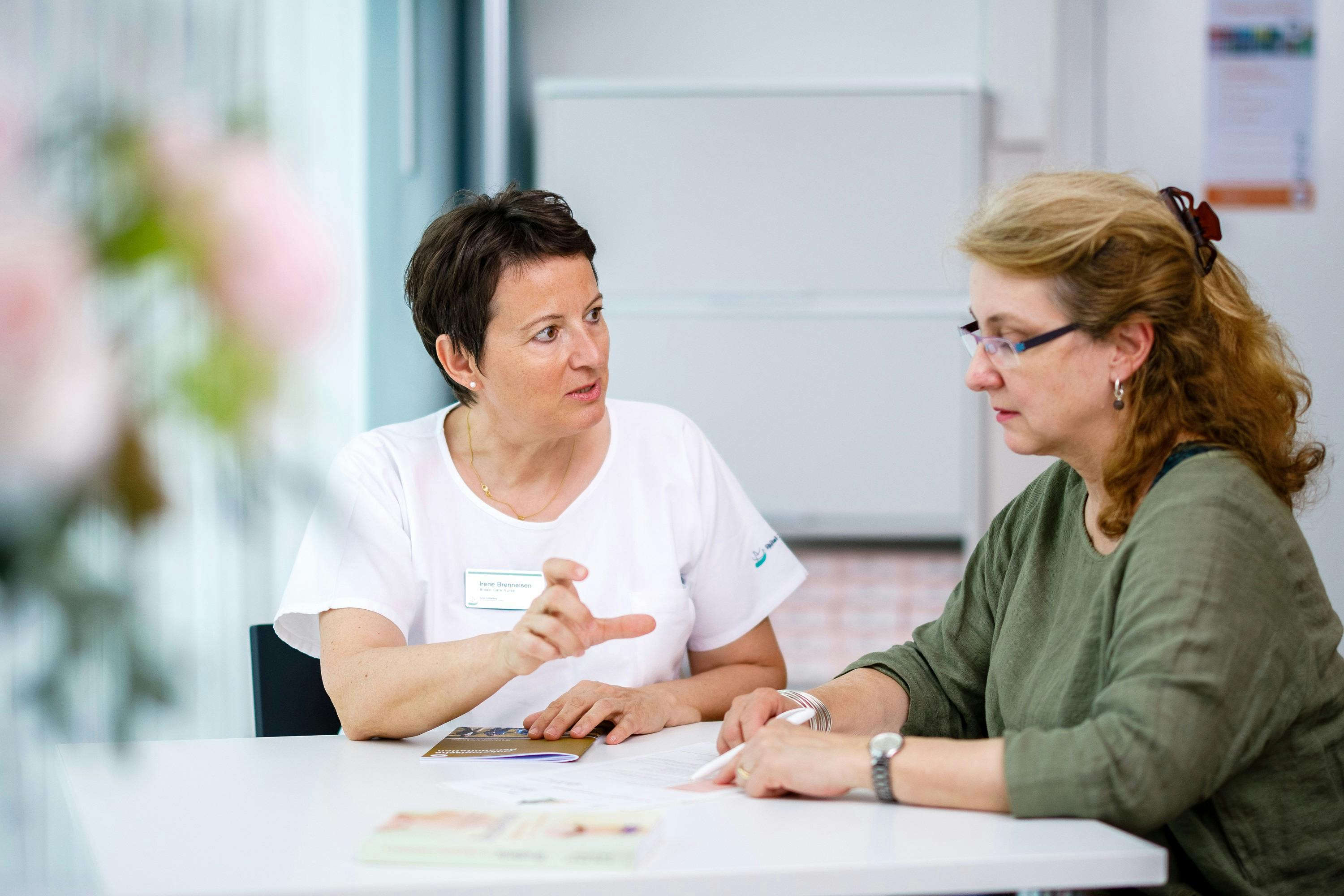 Two women in conversation during a counselling session.